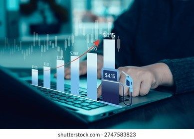 Hand som arbetar vid laptop med diagram över stigande priser och efterfrågan